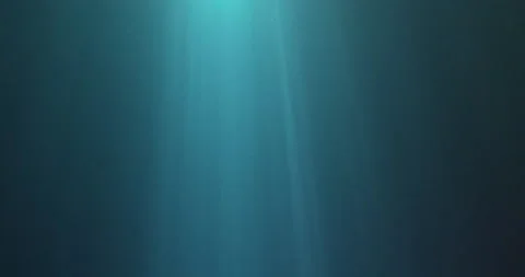 Sunbeams shining through blue water Stock Footage 151705359