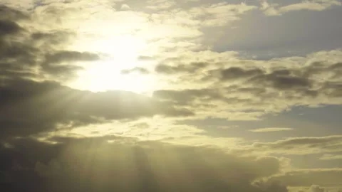 Sunbeams shining through clouds at sunset on the sea Stock Footage 318244288