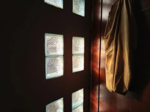 Sunbeams shining through glass bricks Stock Photos