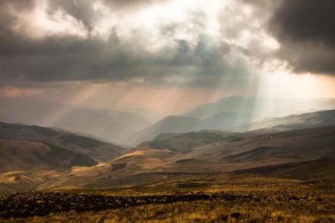 Sunbeams through the clouds Stock Photos