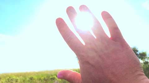 Sunbeams through Hand shining rays Stock Footage 50248076