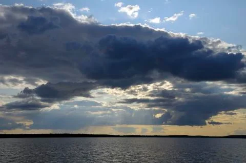 Sunbeams throught rainstorm clouds Stock Photos