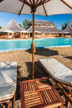 Sunbed and pool Stock Photos