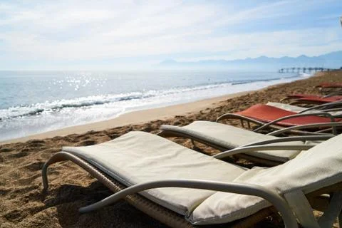 Sunbed and seascape Stock Photos