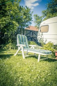 Sunbed in the garden during summer. Stock Photos