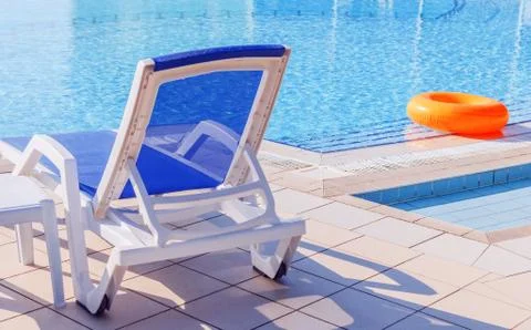Sunbed by pool Stock Photos