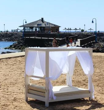 Sunbeds and bar on the beach Stock Photos
