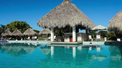 Sunbeds and umbrellas around the pool at the hotel Stock Footage 51084498