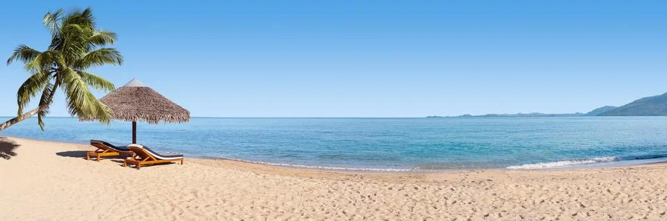 Sunbeds on the beach Stock Photos