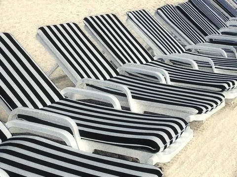 Sunbeds on the beach Stock Photos
