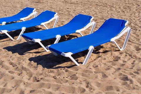 Sunbeds closeup on beach Stock Photos