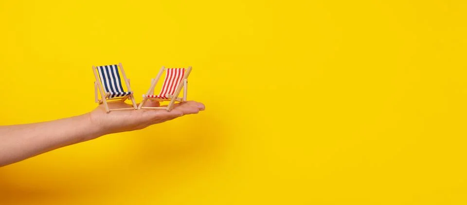 Sunbeds on hand panoramic Stock Photos