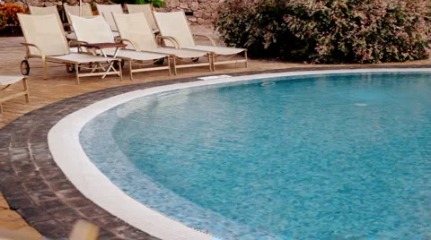 Sunbeds at the pool Stock Footage 1080151