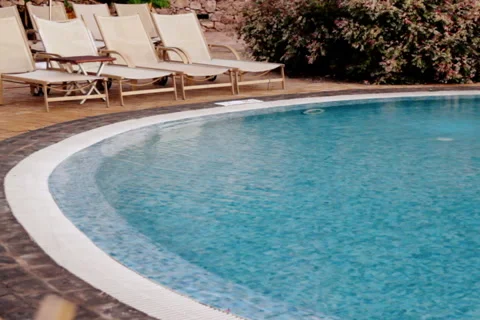 Sunbeds at the pool Stock Footage 1080166