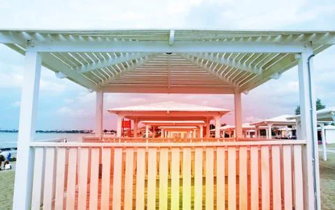 Sunbeds on the sandy beach Stock Photos
