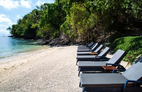 Sunbeds at the sea view Stock Photos