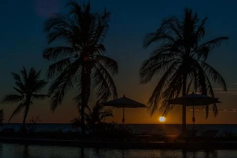 Sunbeds at sunset Stock Photos