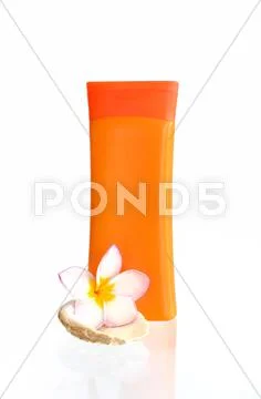 Sunblock with flower and shells Stock Photos