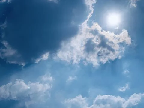 Sunburst and Clouds in Blue Sky Over Jakarta Indonesia Stock Photos
