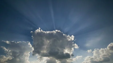 Sunburst from cloud timelapse Stock Footage 728419
