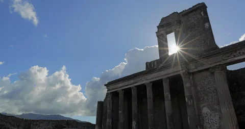 Sunburst rays through the wall of Pompeii ruins, Italy Stock Footage 298975033