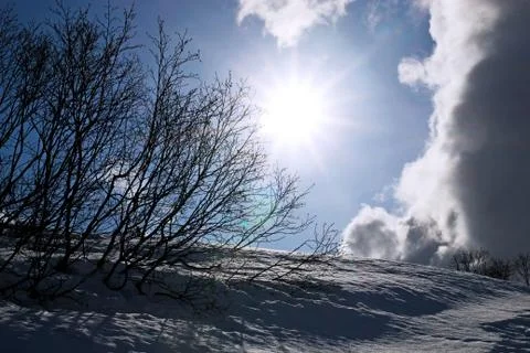 Sunbust in winter with clouds Stock Photos