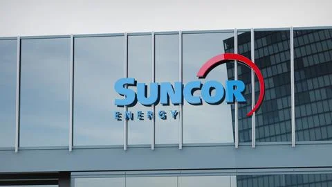 Suncor Energy Stock data presented on the logo of the office facade editorial Stock-Fotos