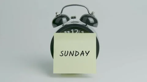 Sunday Text or Word on Yellow Note Paper Sticking onto Black Alarm Clock Stock Footage 299565569