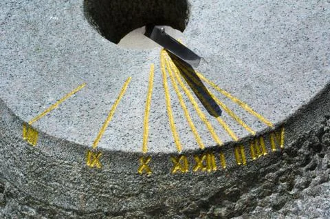 Sundial - device for indicating of time based on shadow of sunlight. Stock Photos