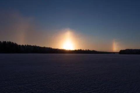Sundogs at winter on lake Stock Photos