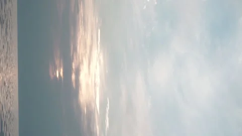 Sundown beach amazing view. The sun, clouds and waves. Vertical video Stock Footage 161163712