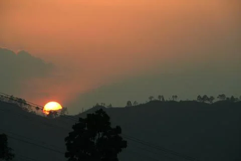 Sundown behind Mountain Stock Photos