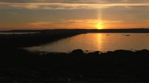 Sundown on Cape Ann the northeastern tip of Gloucester harbor, Massachusetts USA Stock Footage 101981044