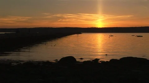 Sundown on Cape Ann northeastern tip of Gloucester harbor, Massachusetts USA Stock Footage 101981052