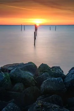Sundown with fish trap at the coast Stock Photos
