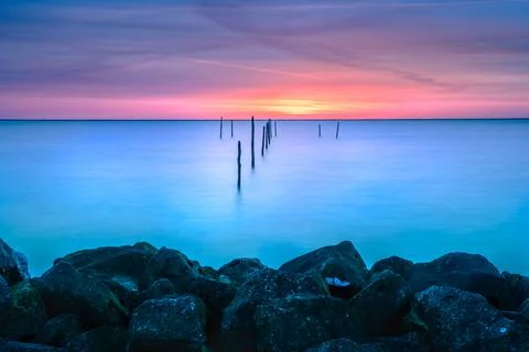 Sundown with fish trap at the coast Stock Photos