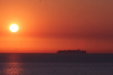 Sundown North sea with container ship. Timelapse Video stock 112769818