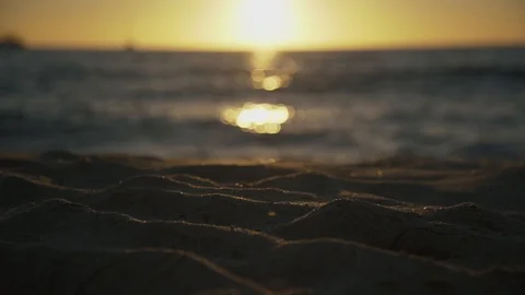 Sundown reflection of the sea surface and beach sand Stock Footage 125213436