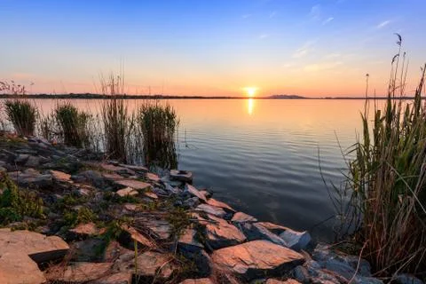 Sunet over lake Stock Photos