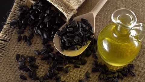 Sunflower seeds and oil close up. Stock Footage