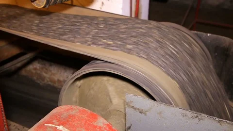 Sunflower seeds are poured down from the conveyor belt in the warehouse Stock Footage 128304732