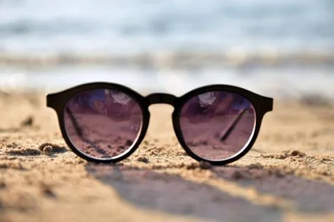 Sunglass is on beach Stock Photos
