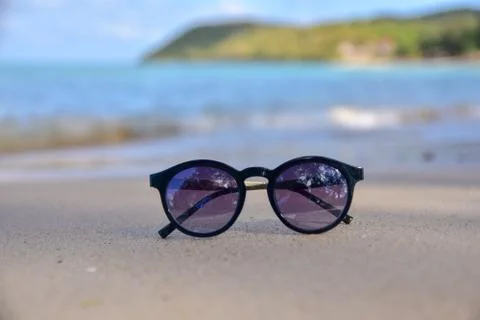 Sunglass is on beach Stock Photos