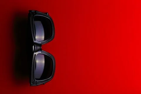 Sunglass on the red background with copy space. Stock Photos
