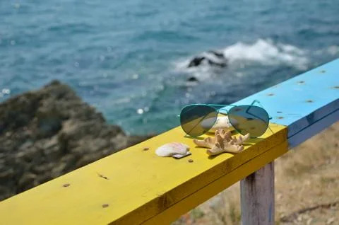 Sunglasses and sea Stock Photos