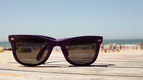 Sunglasses on a beach Video stock 91499038