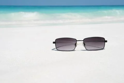 Sunglasses on beach Stock Photos