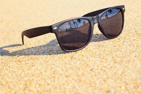 Sunglasses on the beach Stock Photos