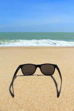 Sunglasses on the beach Stock Photos