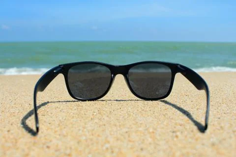 Sunglasses on the beach Stock Photos